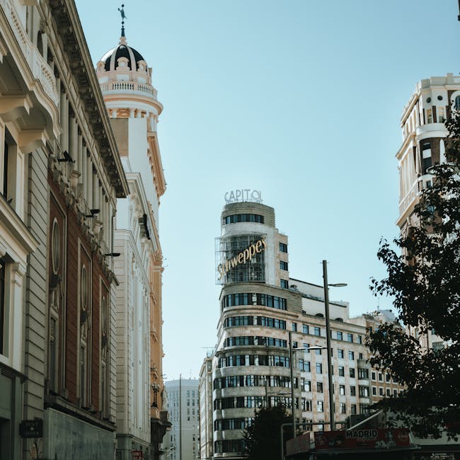 The Edificio Carrion building on Gran Via in Madrid with its art deco tower against a blue sky