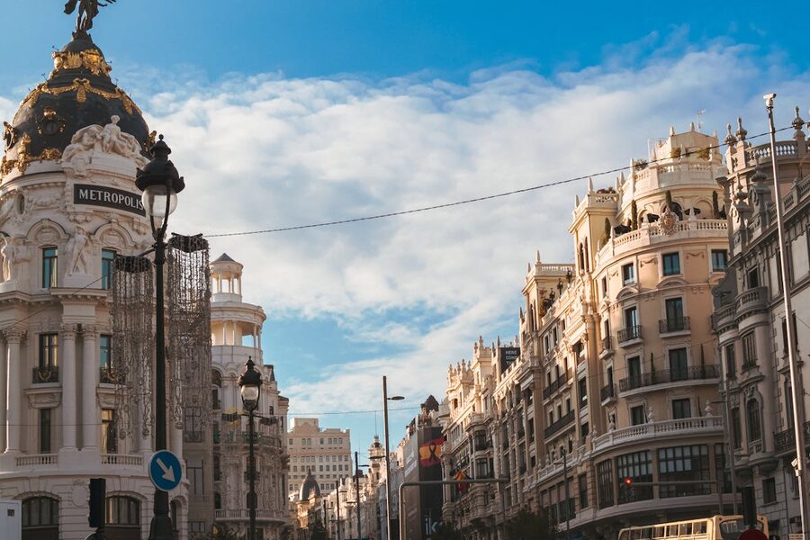The Metropolis Building on Gran Via in Madrid under blue sky