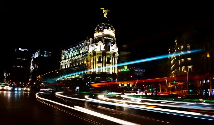 Madrid Gran Via at night showing neon signs and city lights