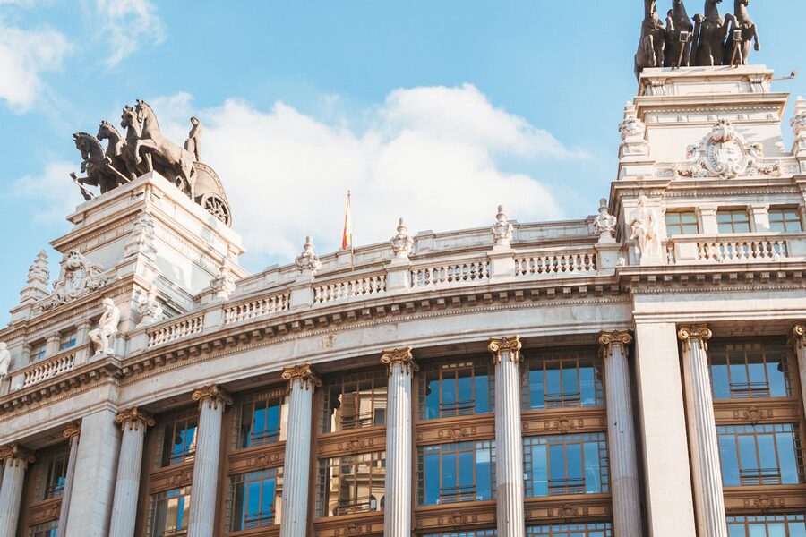 Historic building facade with ornate sculptures in Madrid