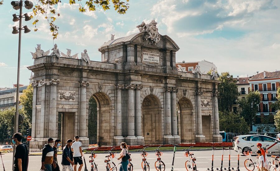Puerta de Alcala gate with pedestrians in Madrid