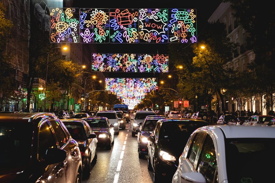 Madrid street illuminated with festive lights at night