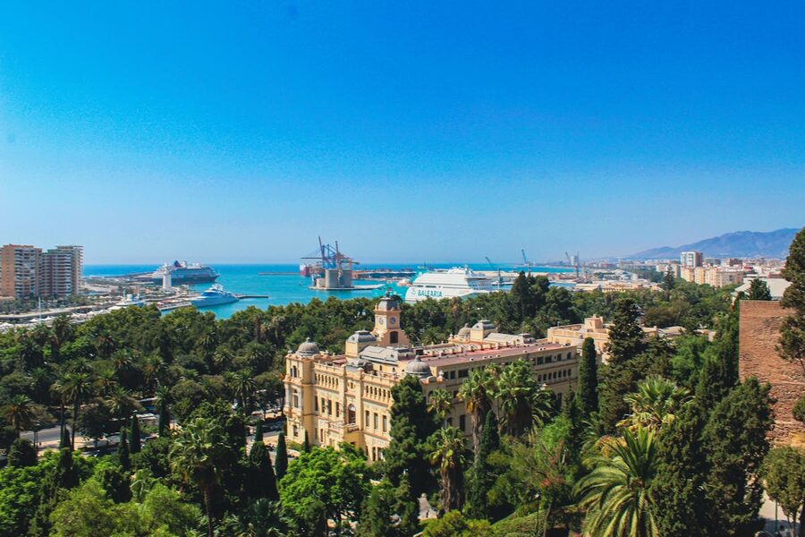 Aerial photograph of Malaga showing the city centre bullring port and Mediterranean coastline