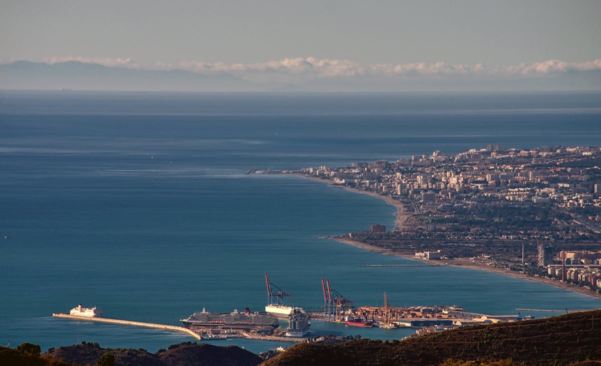Aerial cityscape of Malaga showing the beautiful coastline and port