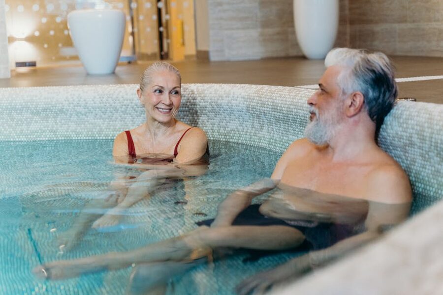 Couple relaxing in indoor spa pool