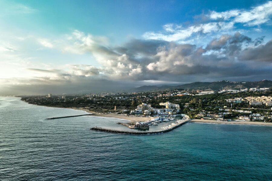 Aerial view of Marbella Spain showing coastline and mountains on the horizon