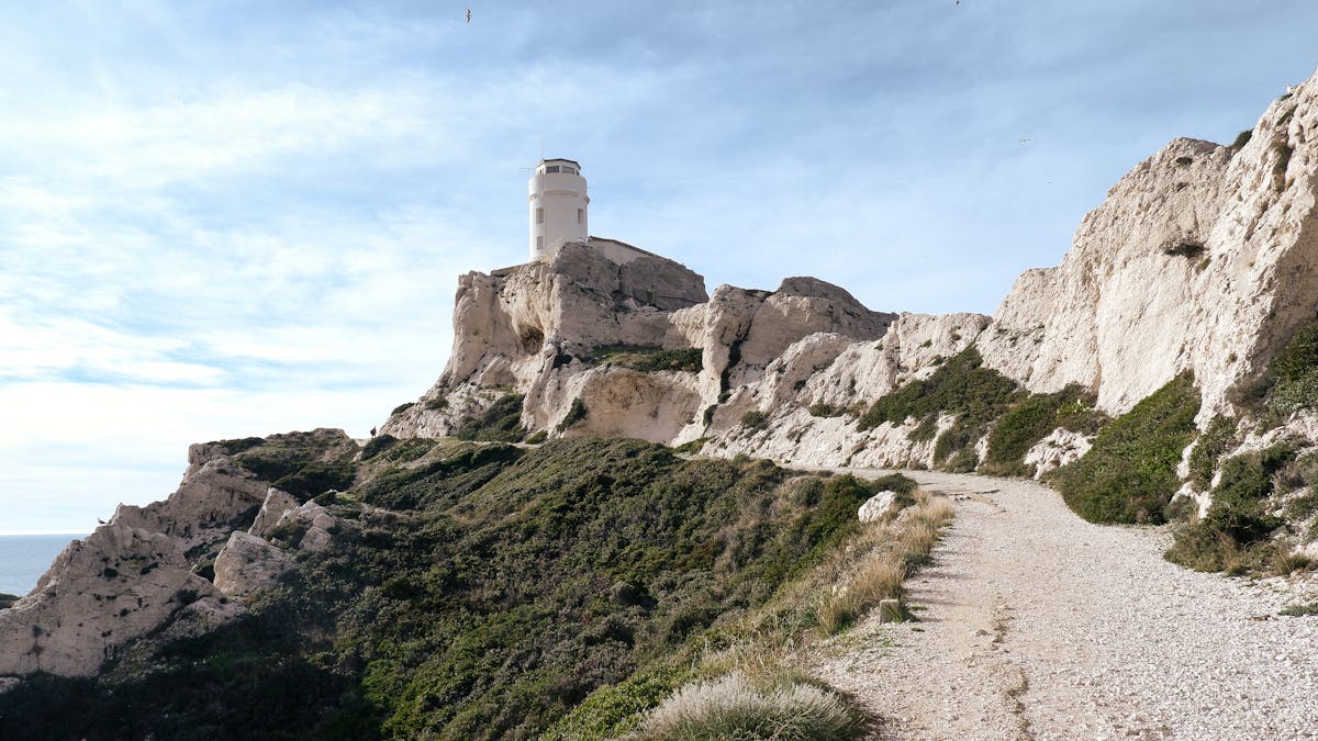 Lighthouse atop limestone cliffs in Marseille France