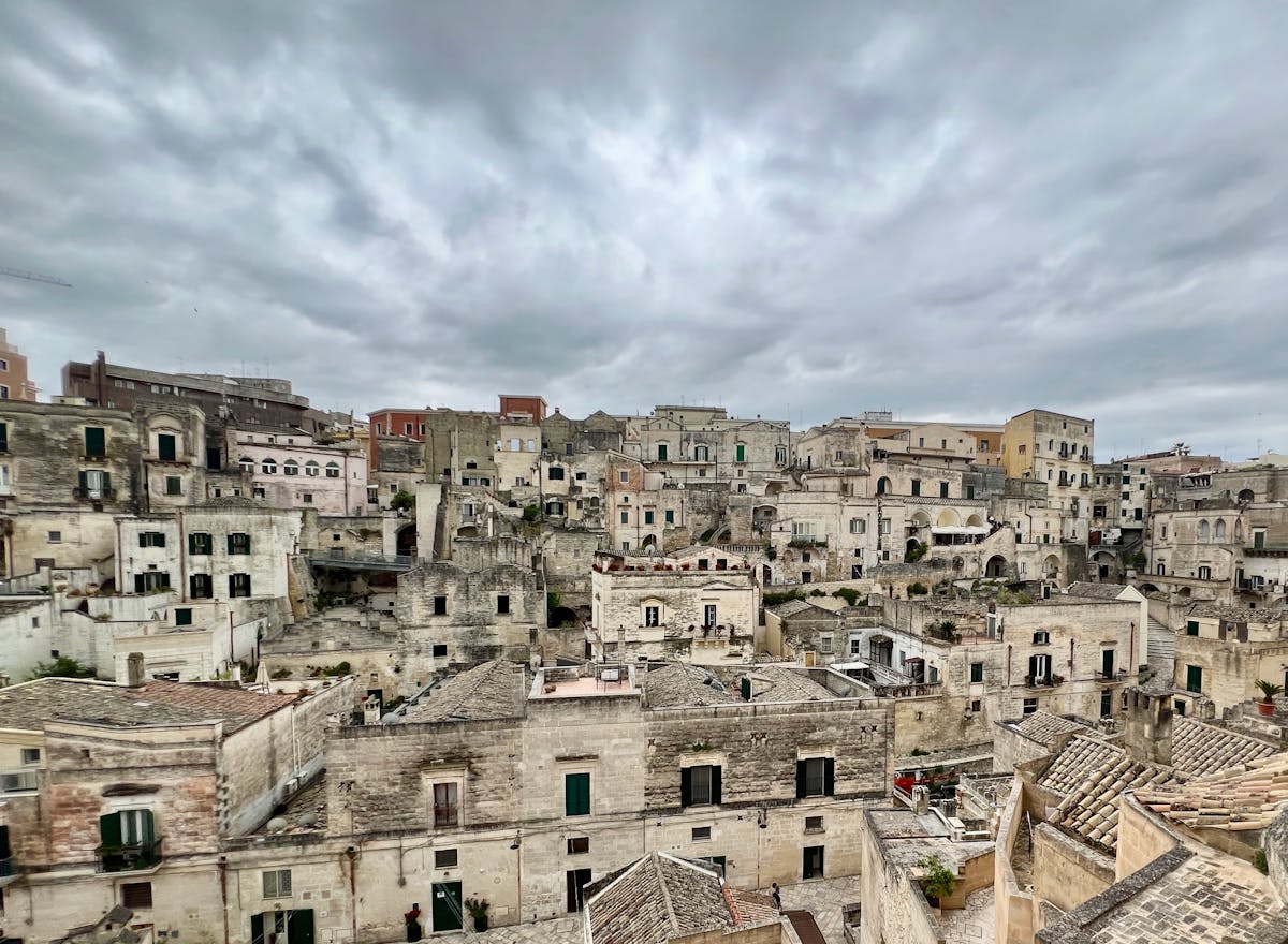 A narrow stone street winding through the old town of Matera Italy