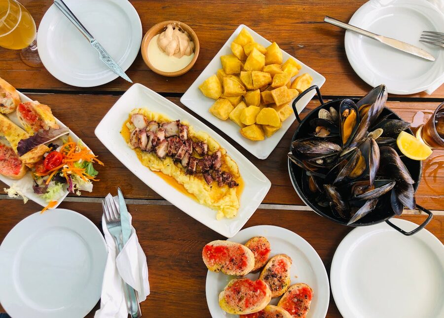 Mediterranean seafood dishes served at a restaurant table