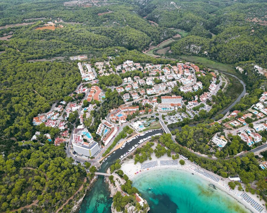 Cala Galdana beach and green hillside landscape in Menorca