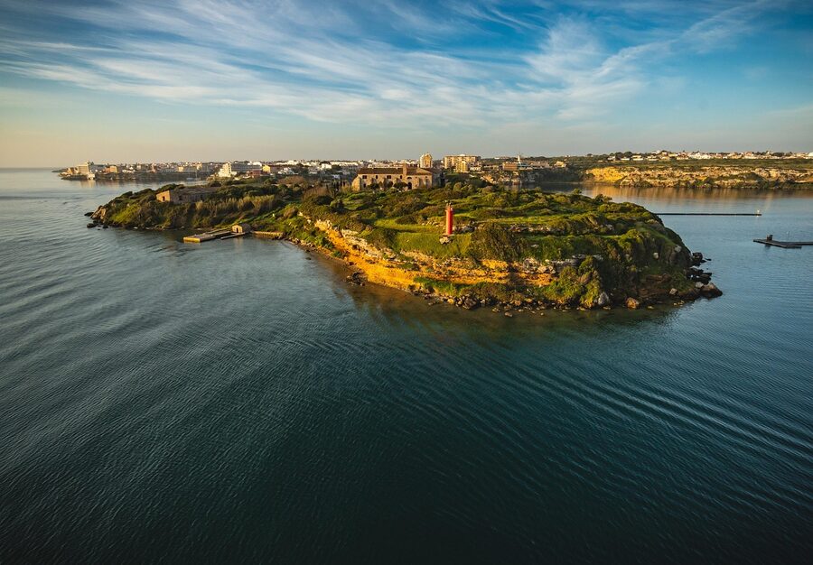 Sunrise over the coast of Menorca with calm Mediterranean sea