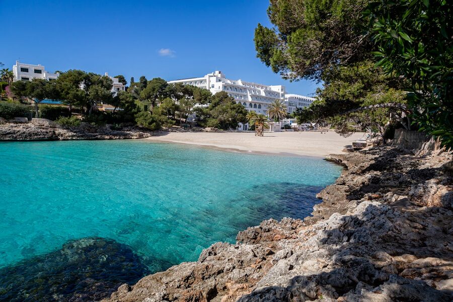 Beachfront resort with turquoise water on the south coast of Menorca
