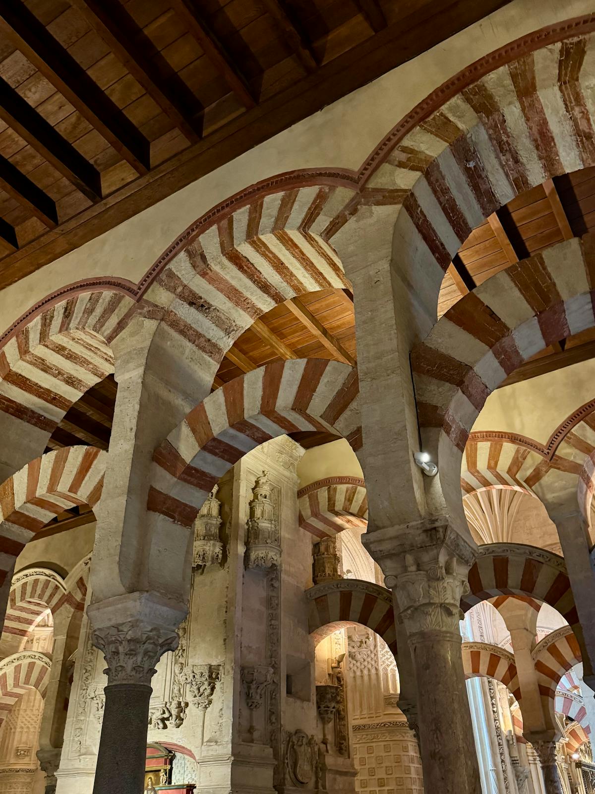 Intricate details of the arches and stonework inside the Mosque-Cathedral of Cordoba