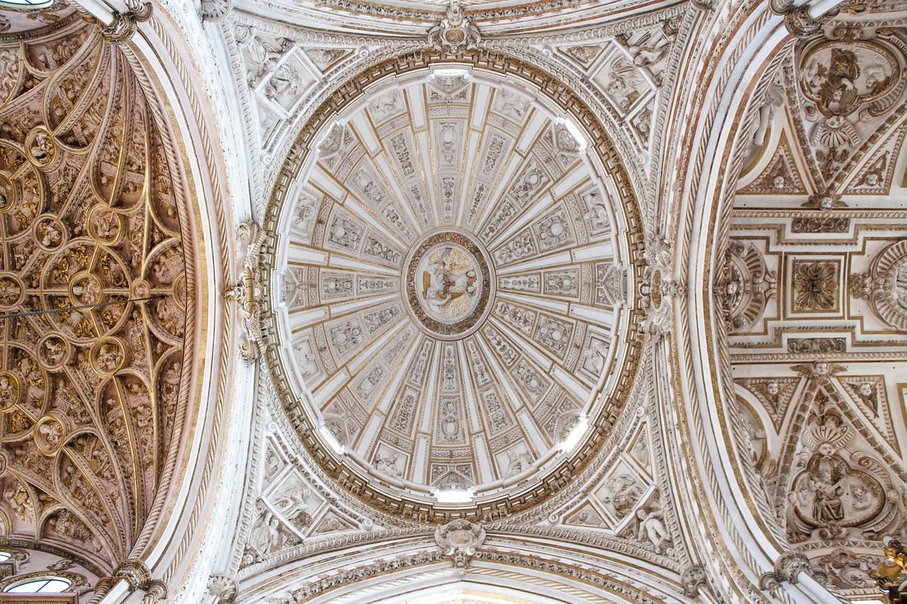 Ornate cathedral dome and Renaissance ceiling painting inside the Mosque-Cathedral