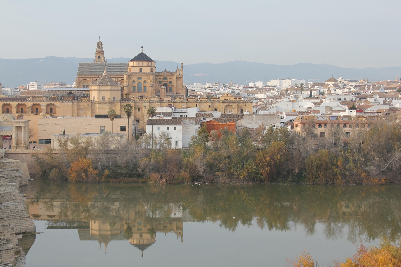 The Mosque-Cathedral of Cordoba seen across the Guadalquivir River with the Roman Bridge
