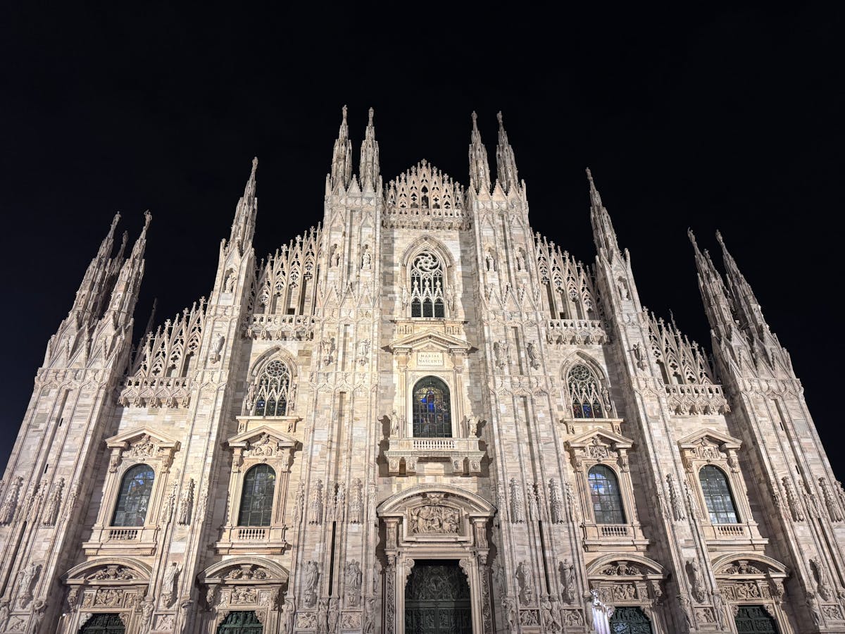 Milan Cathedral facade illuminated at night