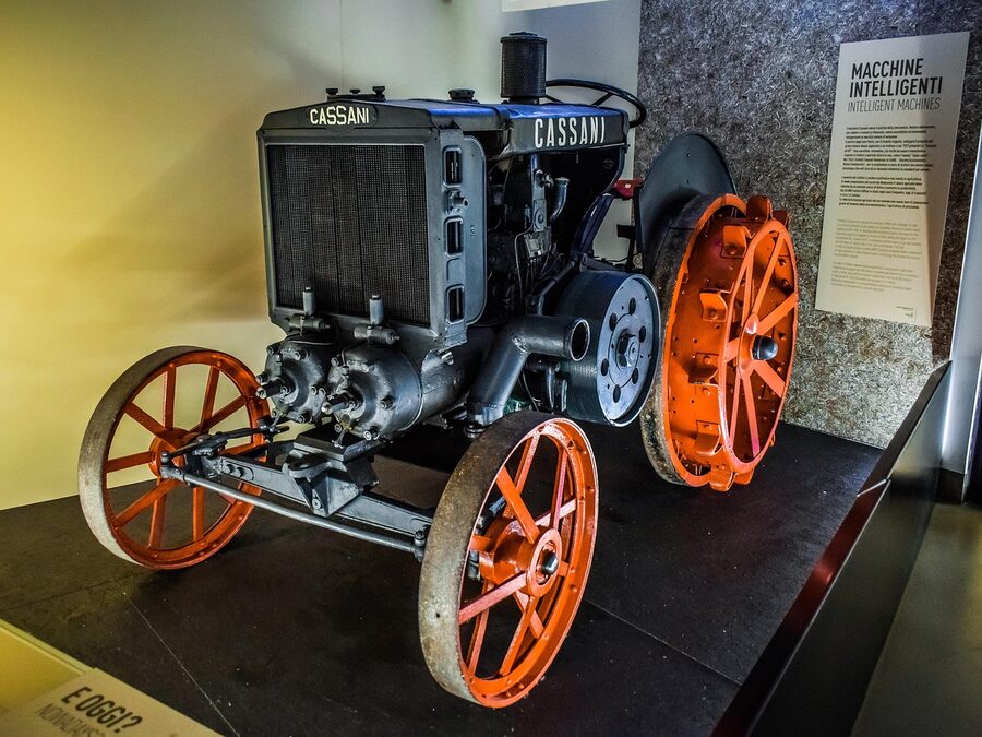 Vintage agricultural tractor on display at the Milan science museum