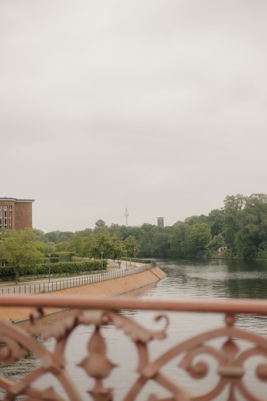 A foggy morning on the Spree River with the TV Tower rising through the mist