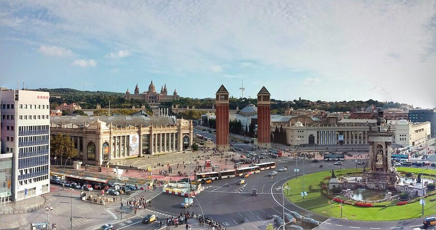 Evening view of MNAC from Placa Espanya with illuminated fountains