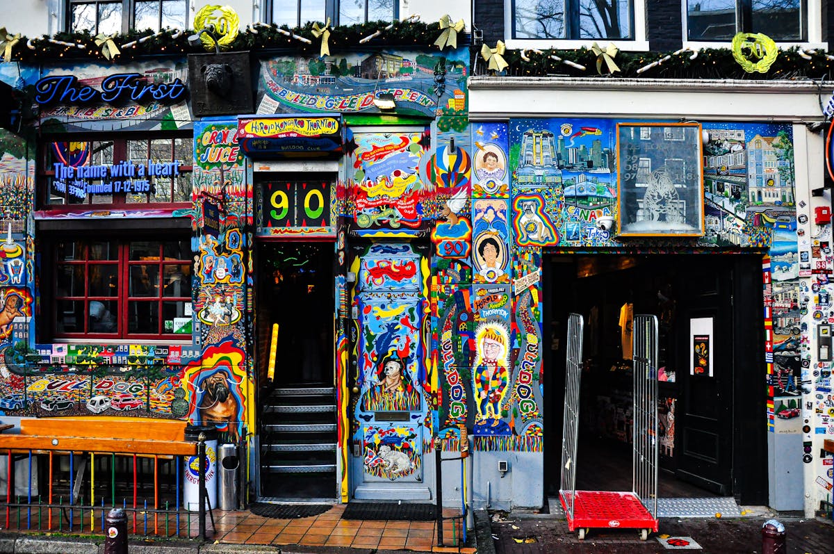 Colorful street art facade of a cafe in Amsterdam neighborhood