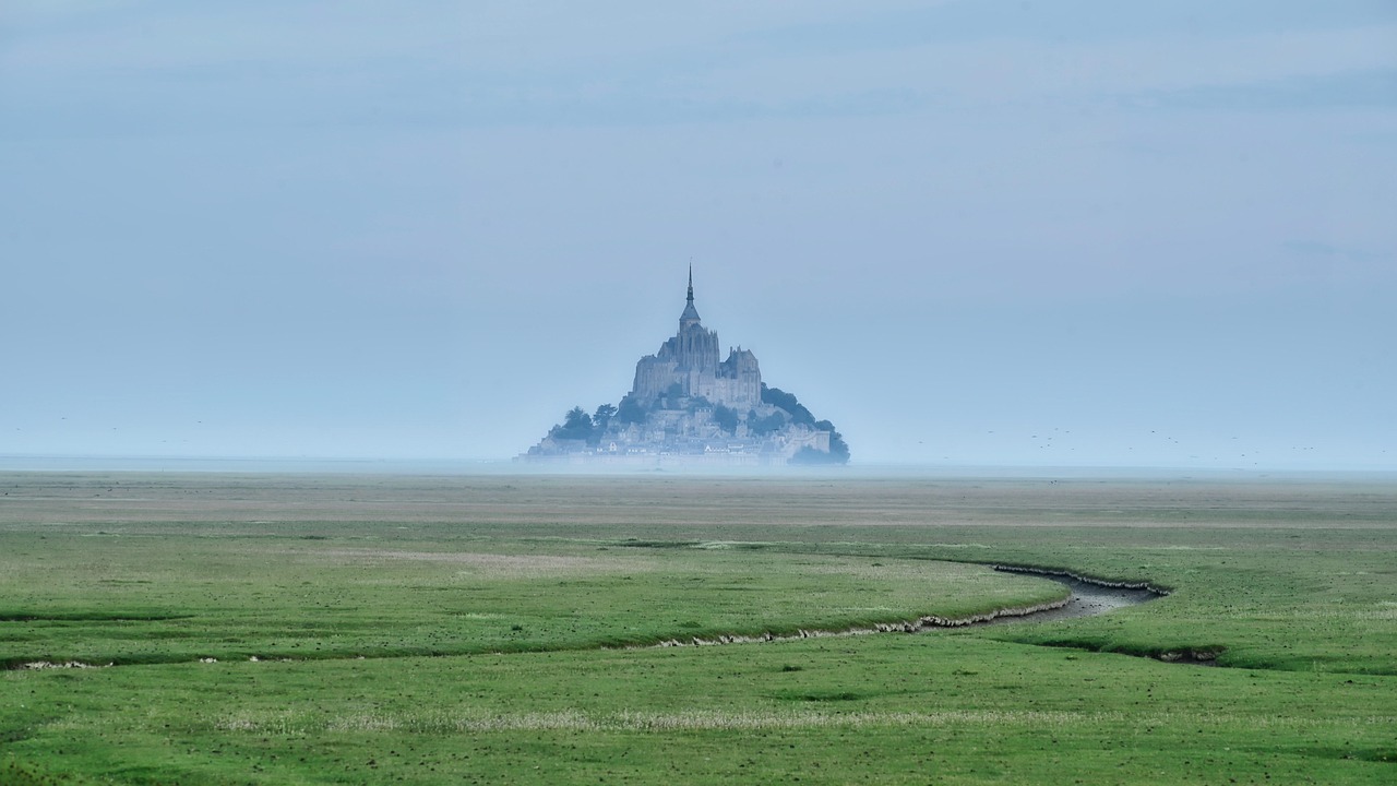Mont Saint-Michel rising from fog at dawn