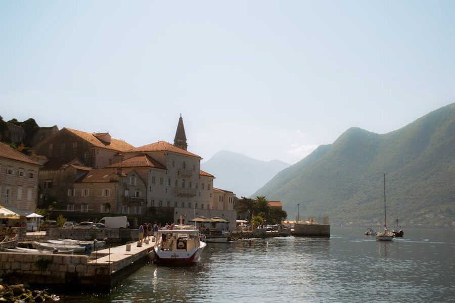 Perast harbor with boats and historic buildings
