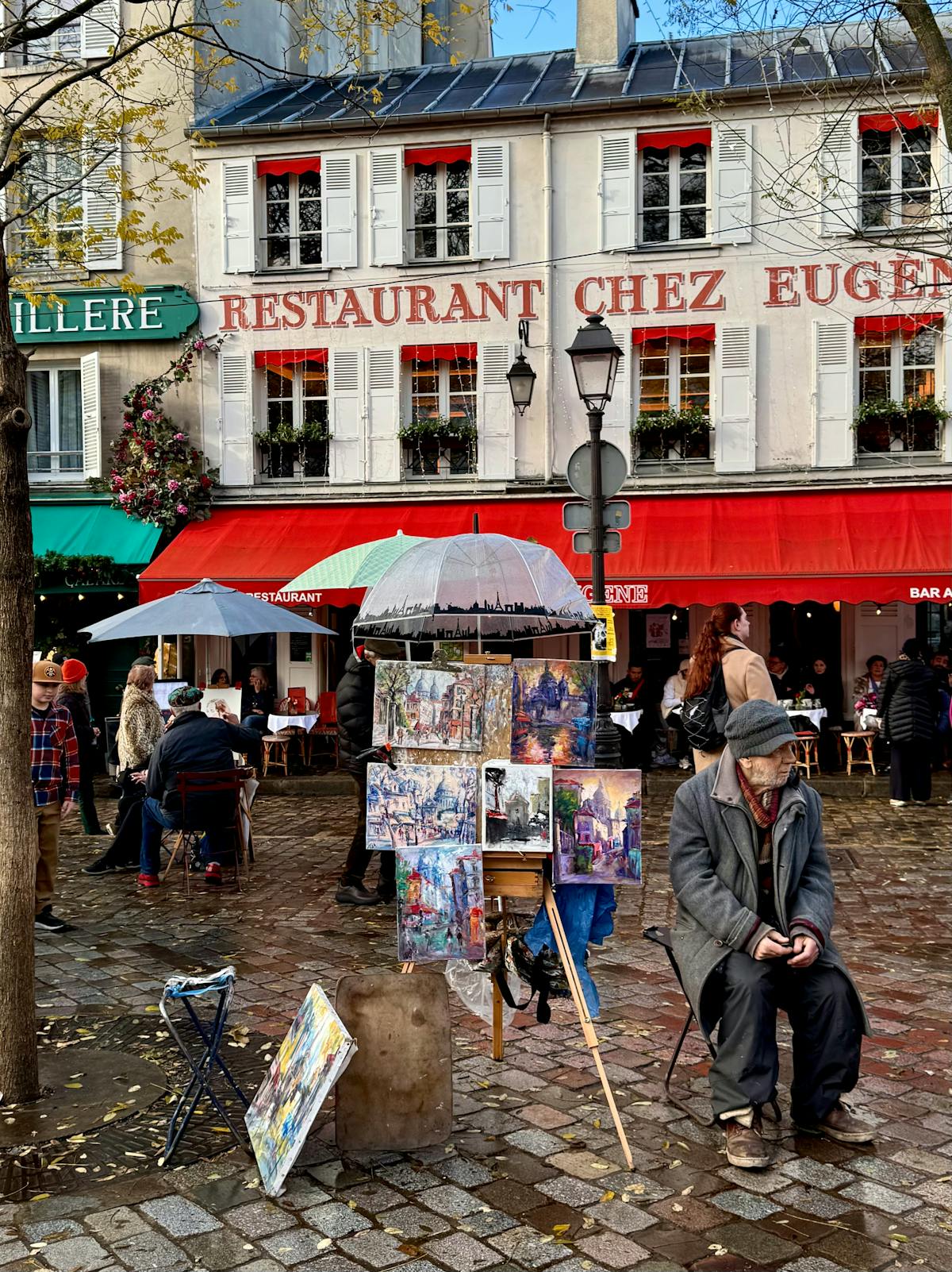 Street artists and cafe tables in Place du Tertre, Montmartre