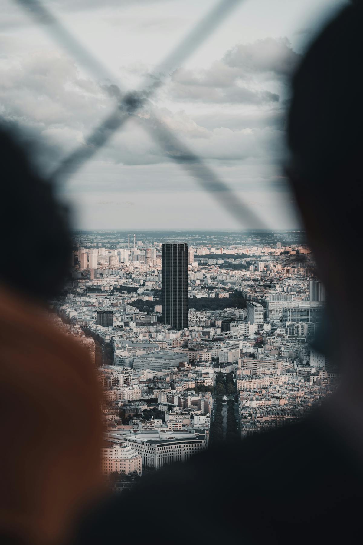 Tour Montparnasse rising above the Paris skyline seen from street level