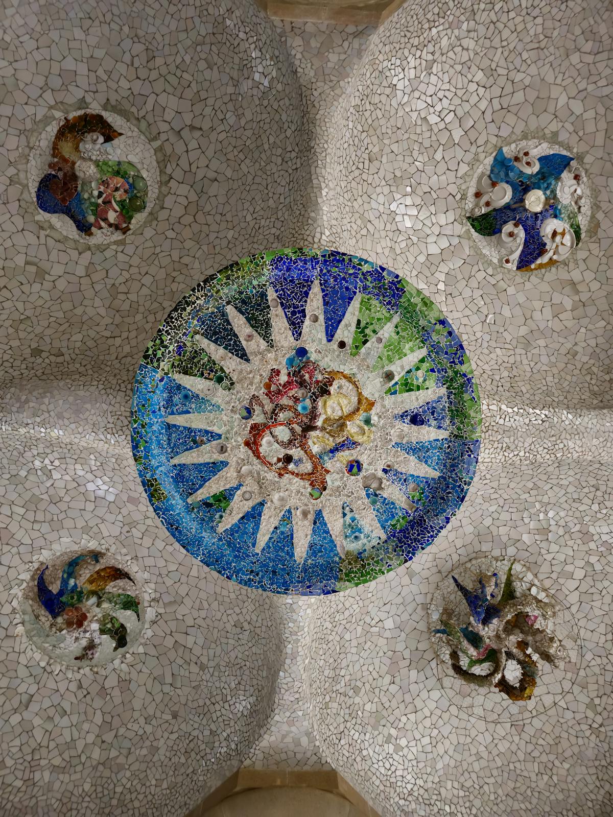 Intricate mosaic ceiling detail in Park Guell Hypostyle Room