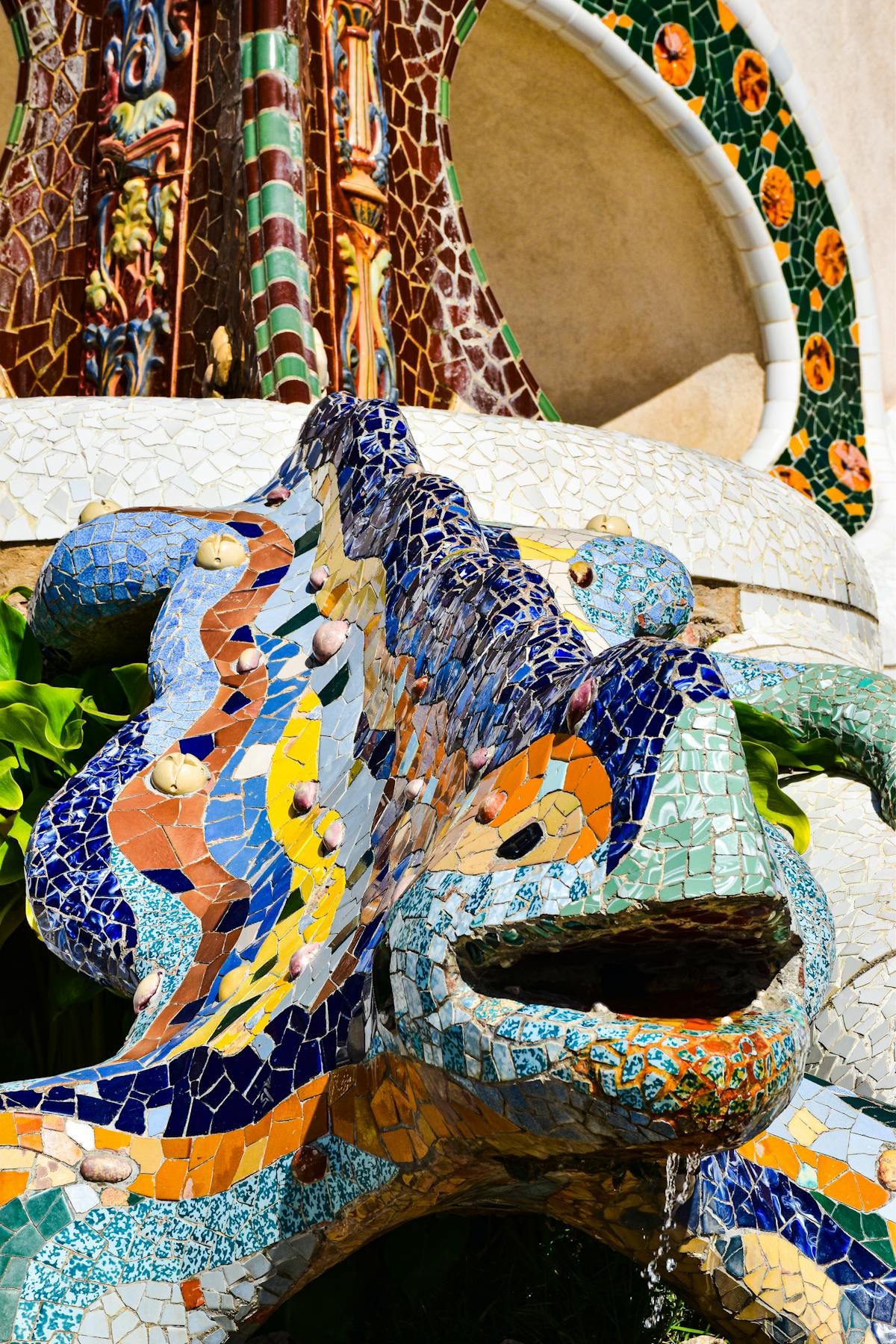 Colorful mosaic dragon sculpture El Drac at the entrance of Park Guell