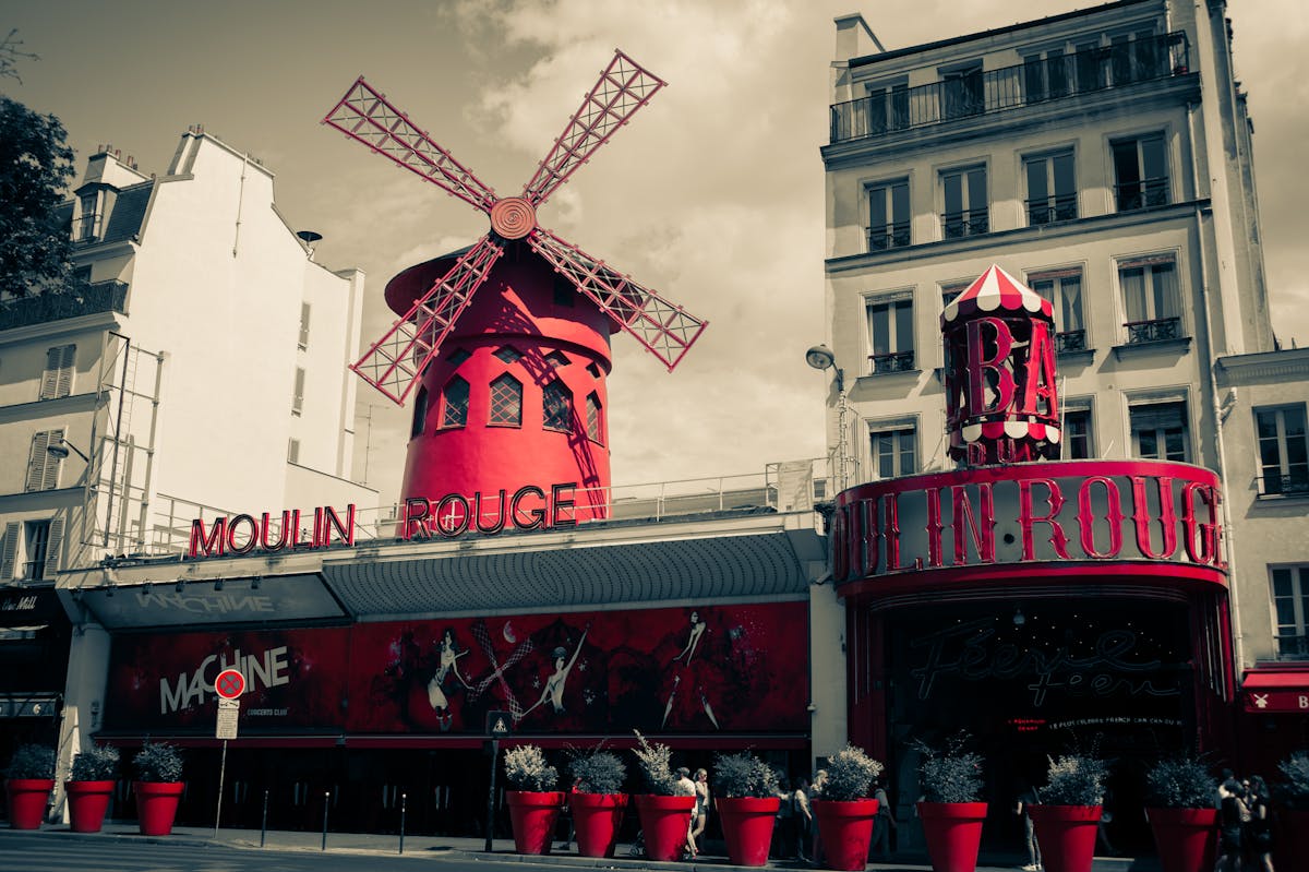 The Moulin Rouge and surrounding buildings seen from the Boulevard de Clichy street level