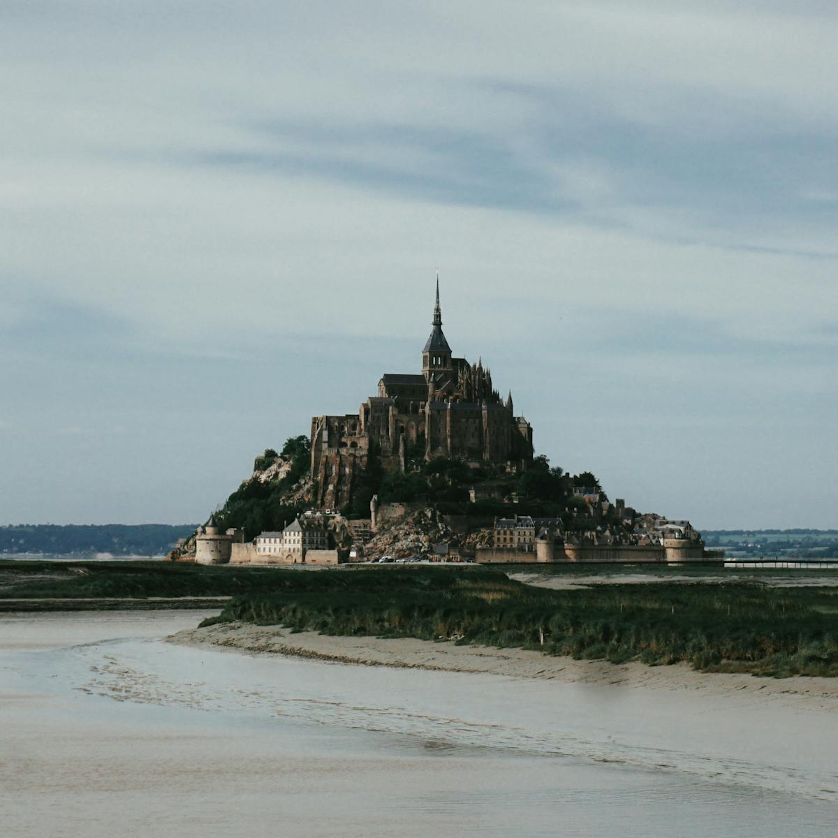 Mont Saint-Michel Abbey perched above the medieval village rooftops