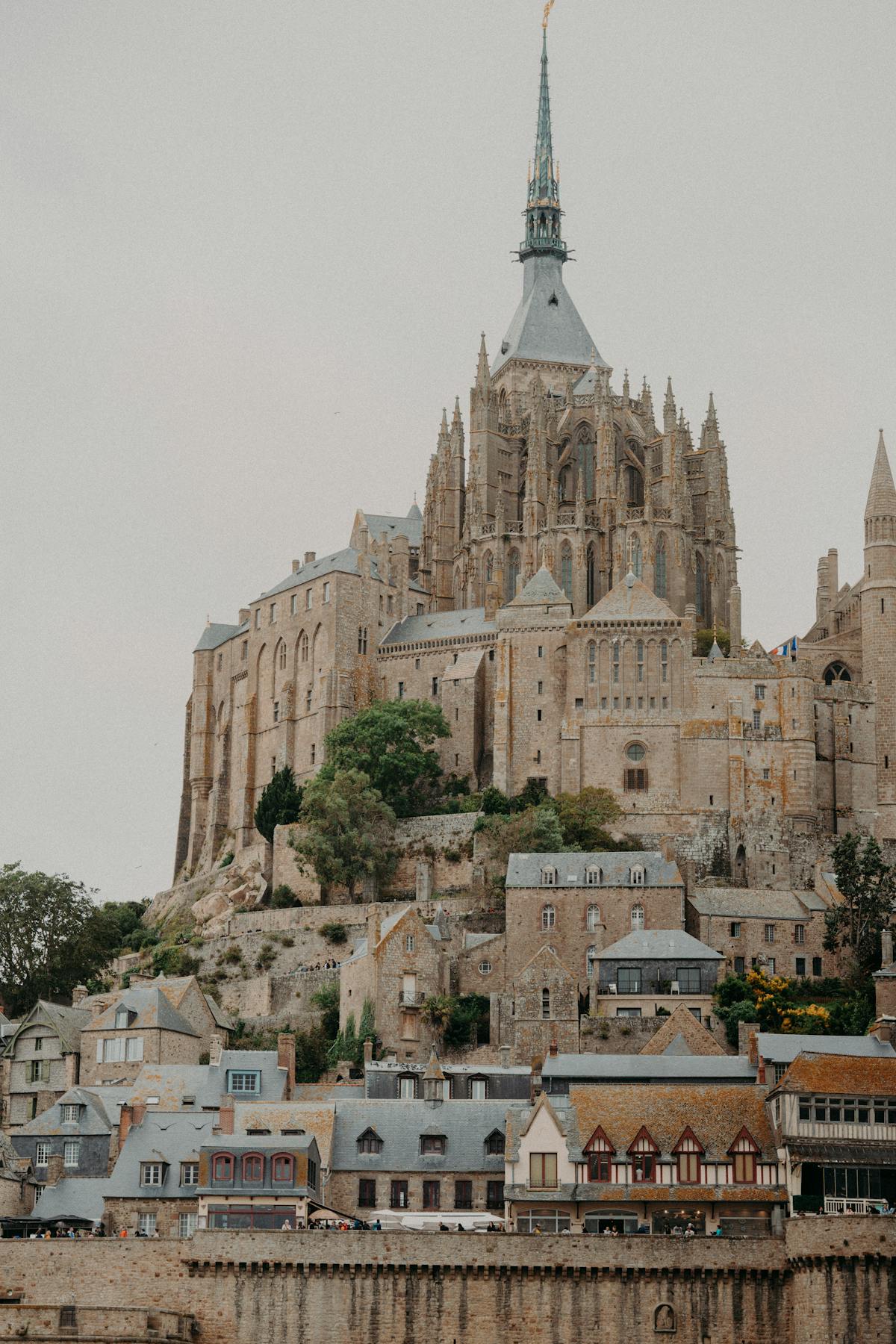 Narrow medieval streets and stone buildings inside Mont Saint-Michel