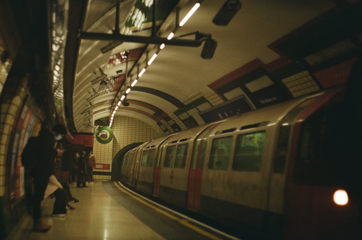 London Underground train pulling into station platform