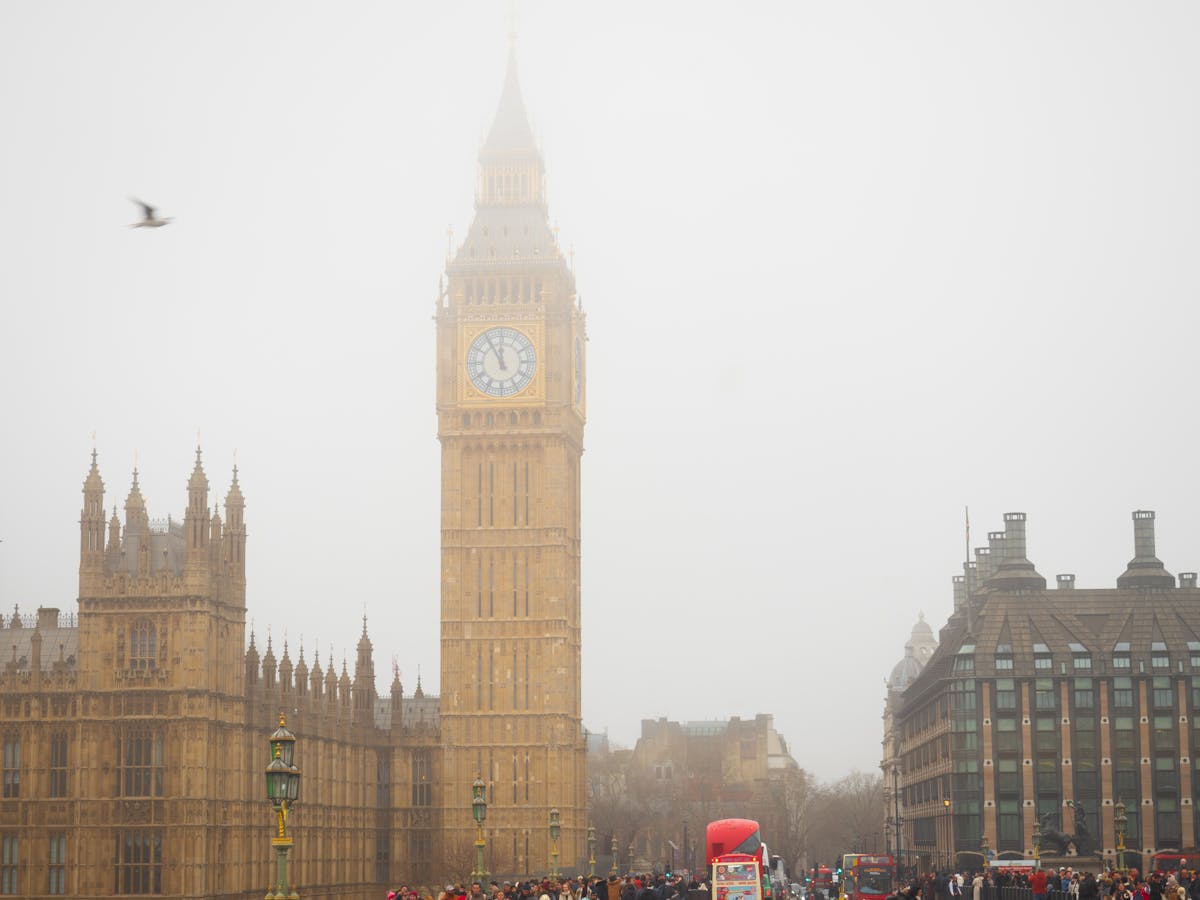 Big Ben clock tower partially hidden by London fog