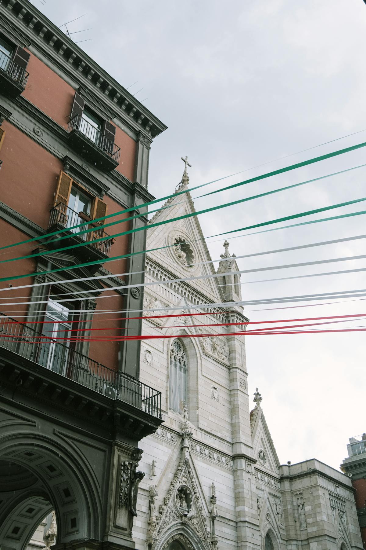 Naples Cathedral with festive Italian colored ribbons overhead