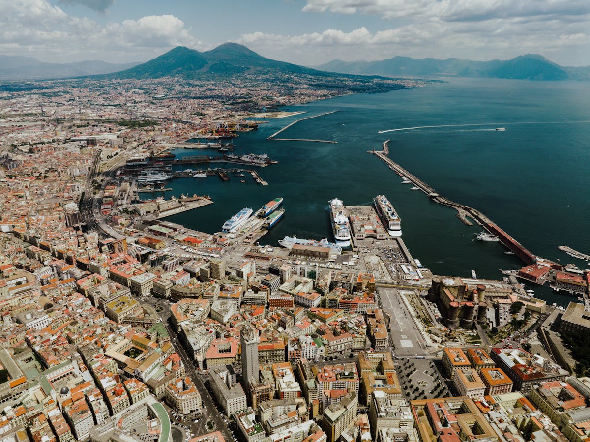 Panoramic aerial view of Naples Italy harbor with Mount Vesuvius in the background