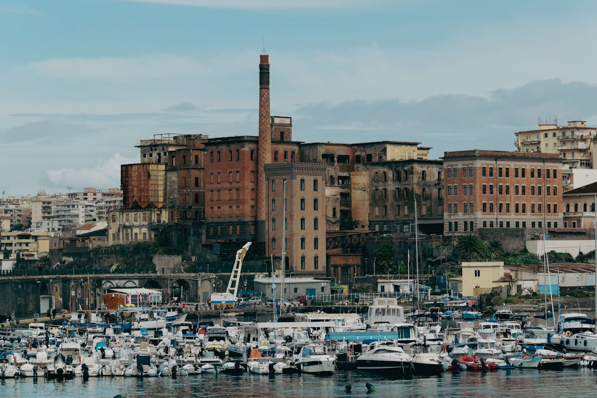 Historic port view of Naples Italy with urban architecture and the sea