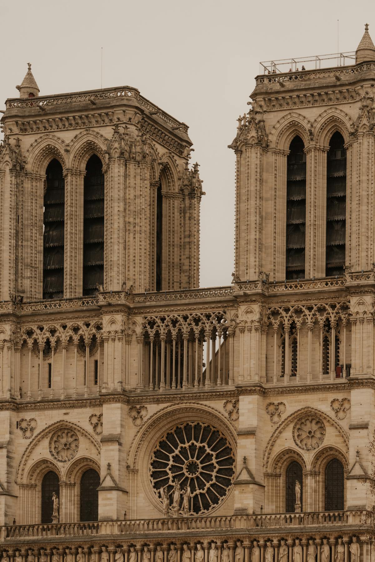 Close-up view of Notre-Dame de Paris Gothic architectural details and stone carvings on the facade