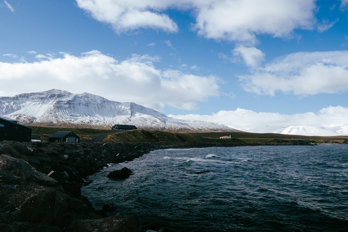 Scenic Icelandic fjord surrounded by snow-capped mountains