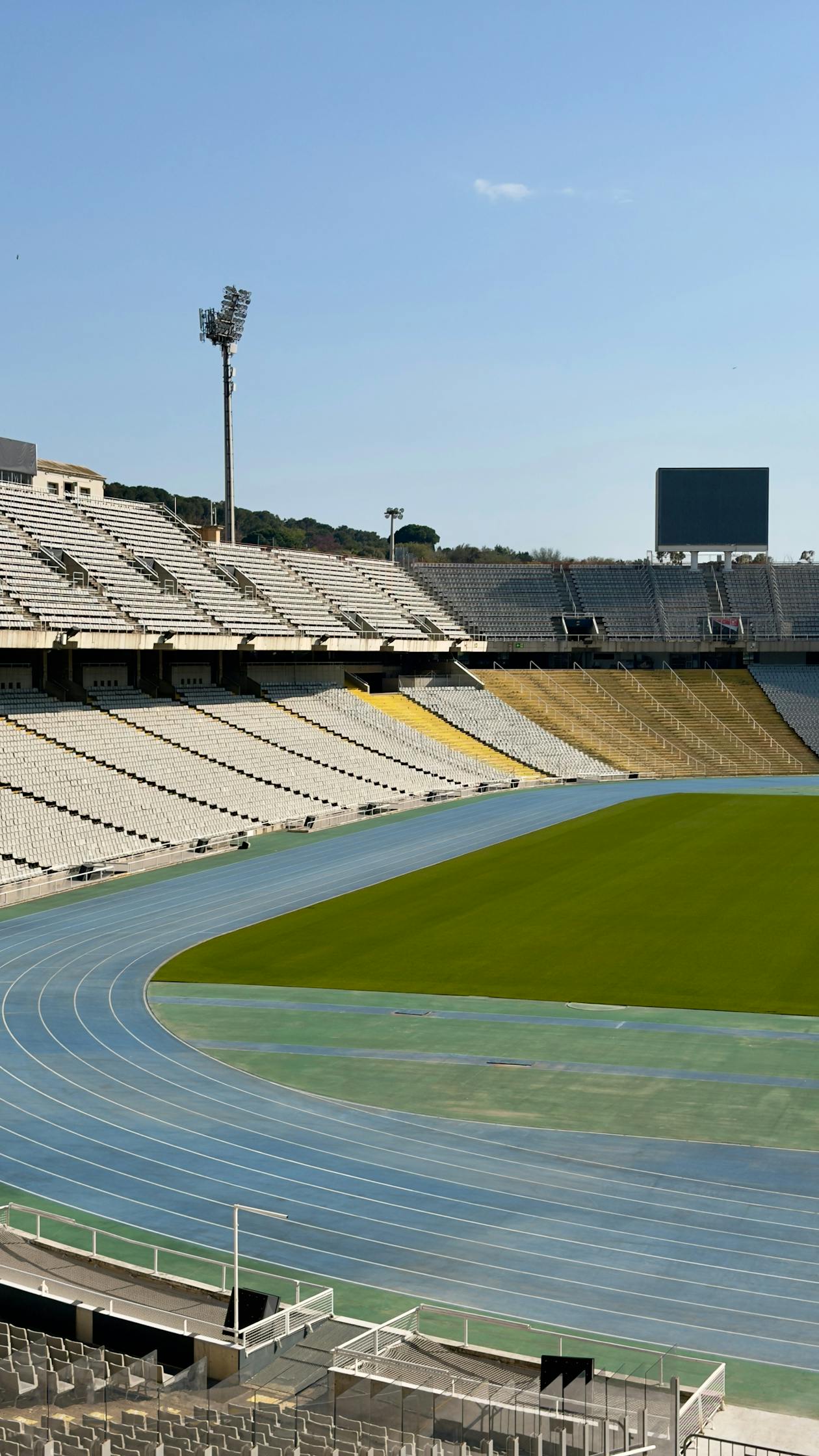 Barcelona Olympic Stadium on Montjuic hill with the running track and empty stands