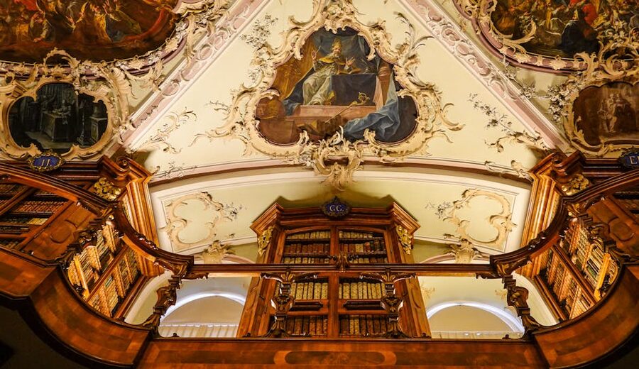 Ornate ceiling with frescoes in a classical library