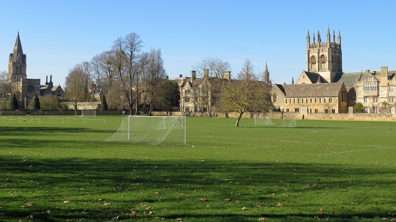 Christ Church College viewed from the meadow with green grass