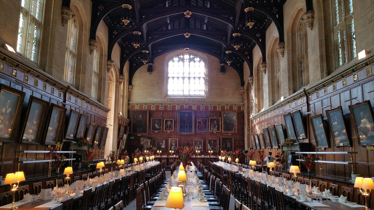 Interior of the Great Hall at Christ Church College Oxford with wooden beams and portraits