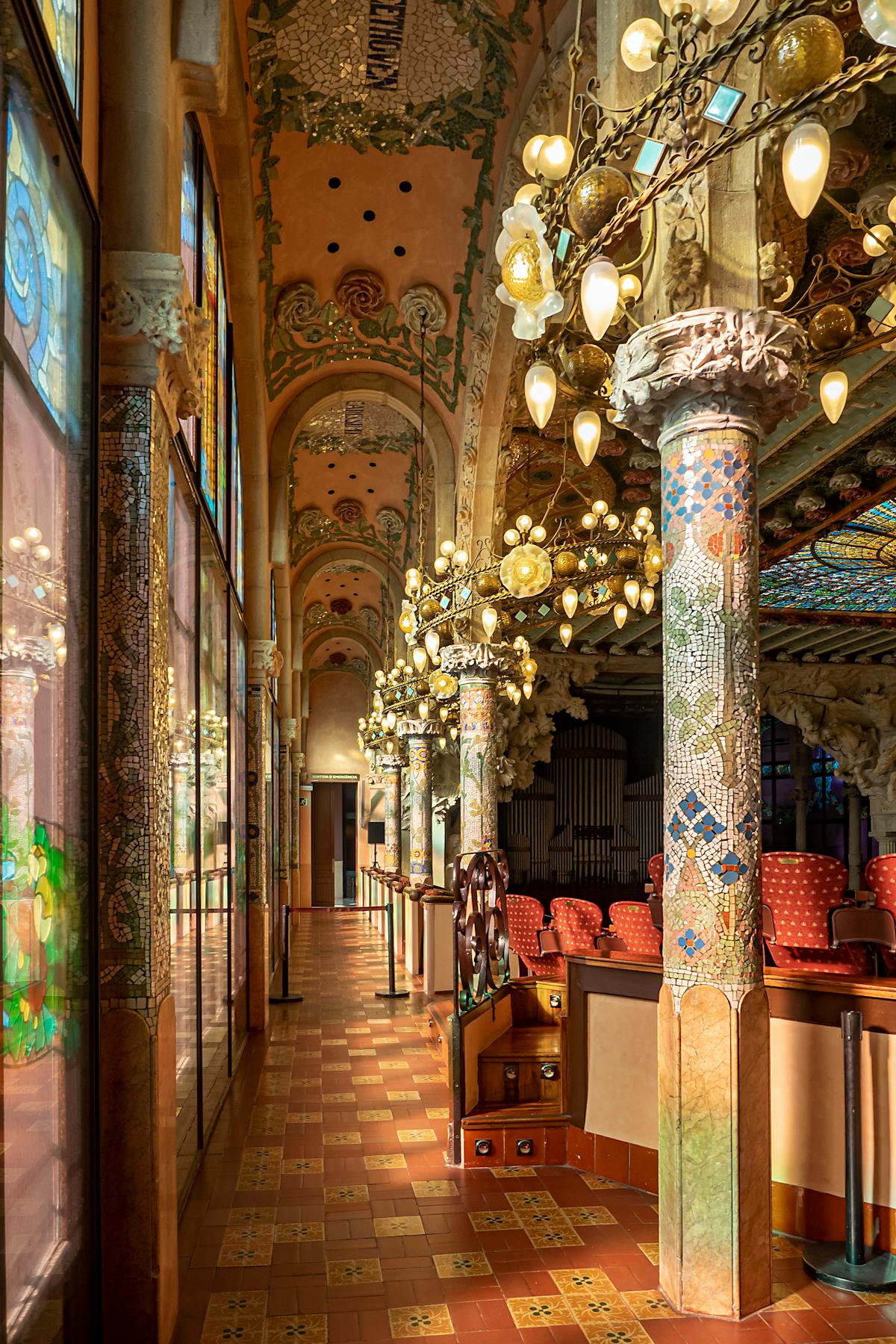 Close-up of ceiling details inside Palau de la Musica Catalana showing intricate Modernista patterns