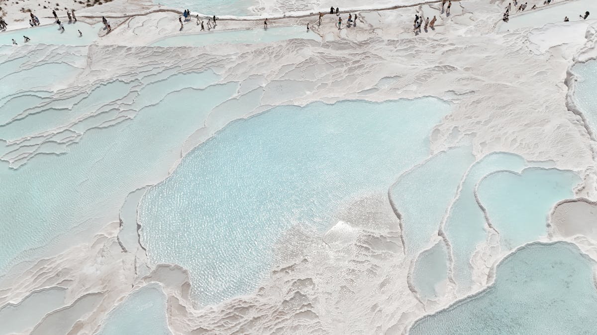 Aerial view of Pamukkale travertine terraces stretching across the hillside