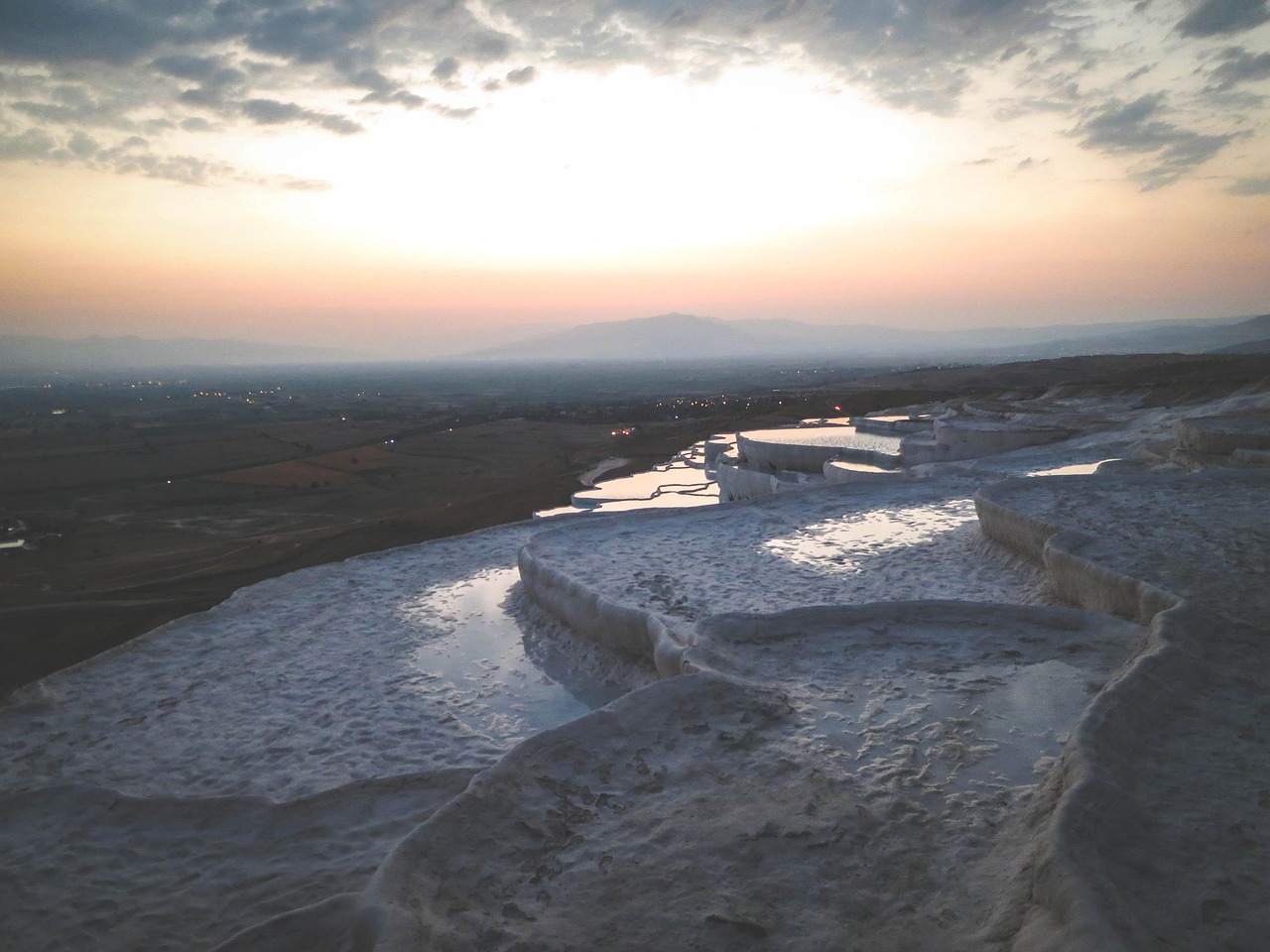 Panoramic view of Pamukkale terraces with the valley stretching below