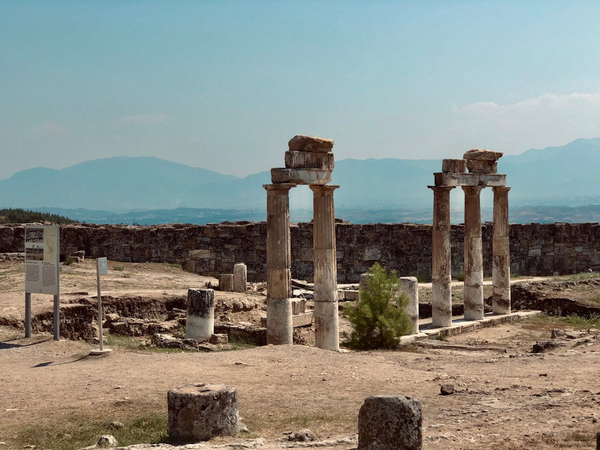 Ancient ruins of Hierapolis with columns and stone structures at Pamukkale