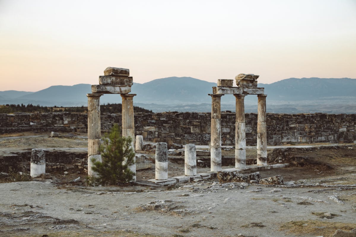 Columns of the ancient ruins of Hierapolis at Pamukkale against blue sky