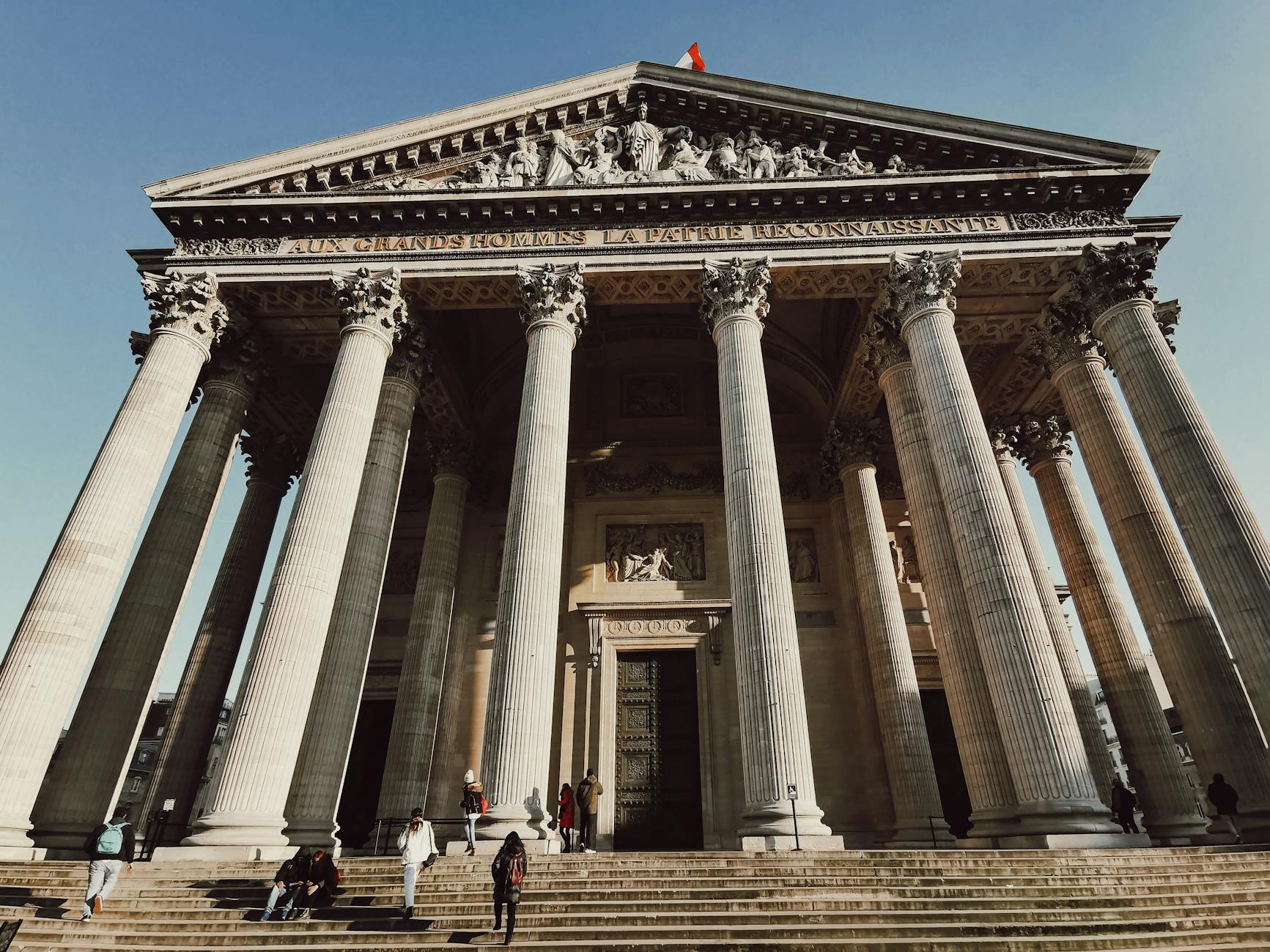 The majestic neoclassical facade of the Pantheon in Paris with tall columns